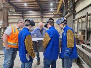 Welding students attend safety briefing.
