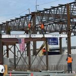 Photo of workers installing the final beam for South Brooklyn Marine Terminal project