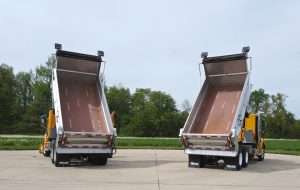 Photo of both trucks with raised beds