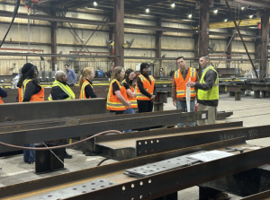 American Institute of Steel Construction members being given a demonstration in the Mid West Division facility