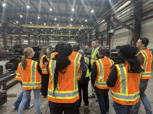 American Institute of Steel Construction members being given a tour of the Mid West Division facility